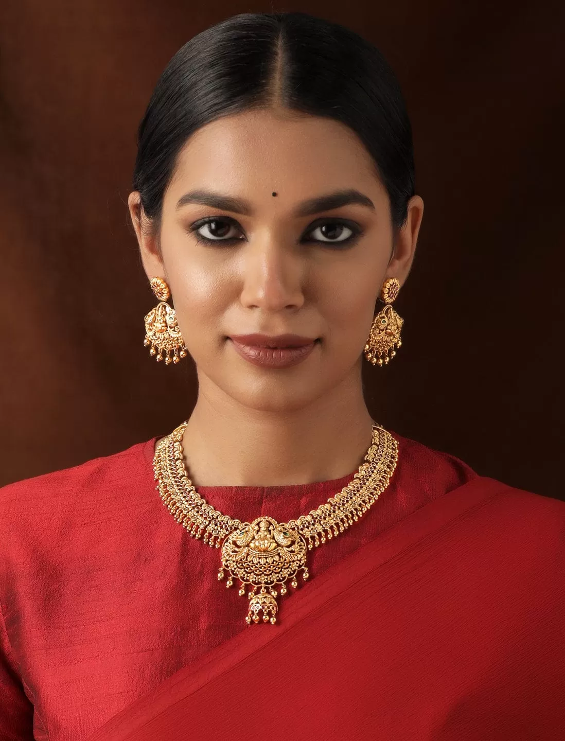 Rubans 22K Gold plated Delicate handcrafted Goddess motif Lakshmi Luxury Temple Necklace Set